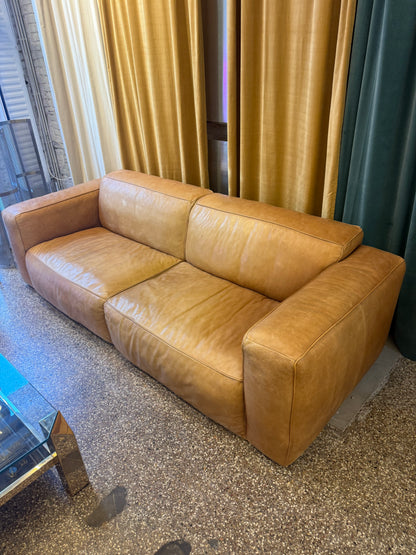 Fauteuil en cuir cognac de la marque Flamant